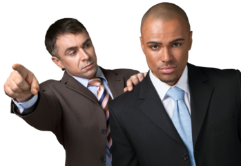 One businessman pointing and looking sternly at another businessman