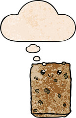 cartoon biscuit and thought bubble in grunge texture pattern style
