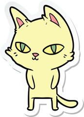sticker of a cartoon cat with bright eyes