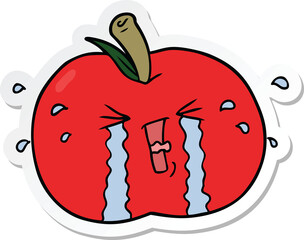 sticker of a cartoon apple crying