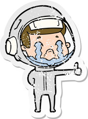 distressed sticker of a cartoon crying astronaut