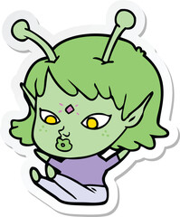 sticker of a pretty cartoon alien girl sitting
