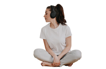 Calm caucasian young woman in casual using headphones sitting  listens music. Brunette hispanic...