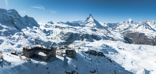 Aerial panorama view of the luxury hotel and the astronomic observatory at the Gornergrat, in the background of the Matterhorn or Cervino mount, Zermatt, Valais, Switzerland, Europe