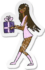 retro distressed sticker of a cartoon fashion girl with present