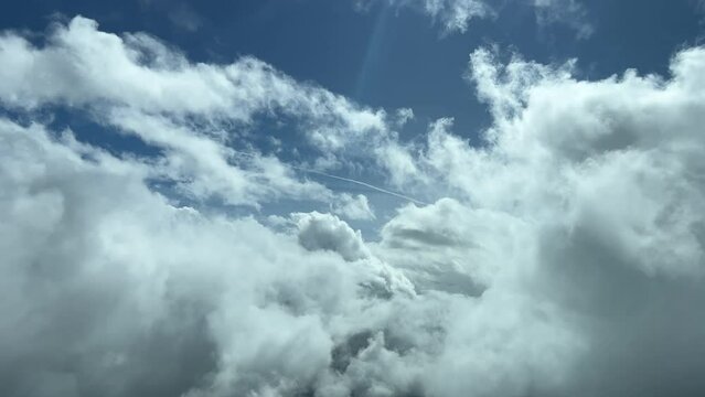 An unique pilot&rsquo;s perspective: flying trough the clouds in a splendid sunny day. Pilot point of view.