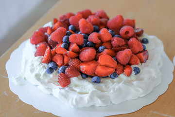 pavlova cake with strawberries and rasberries, strawberry party