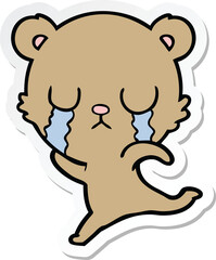Fototapeta premium sticker of a crying cartoon bear running away