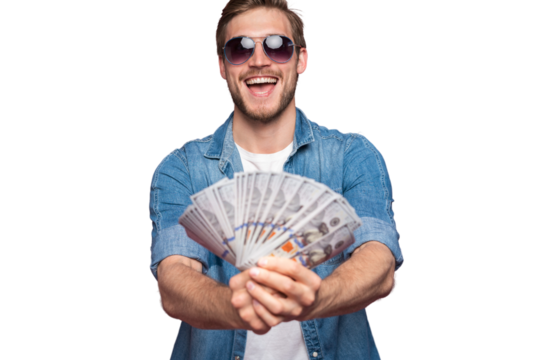 Portrait of joyful man in jeans shirt holding bunch of money banknotes while standing and celebrating isolated over transparent background
