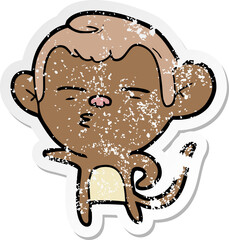 distressed sticker of a cartoon suspicious monkey