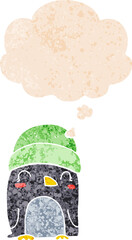 cute cartoon penguin and thought bubble in retro textured style