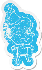 happy cartoon distressed sticker of a man wearing santa hat