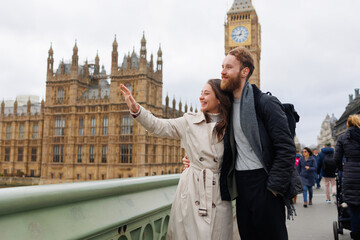 Young couple looking at famous places in London