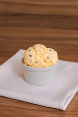 American flavored ice cream with raisins on a wooden table.