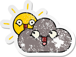 distressed sticker of a cute cartoon storm cloud and sun
