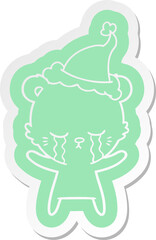crying cartoon  sticker of a polarbear wearing santa hat