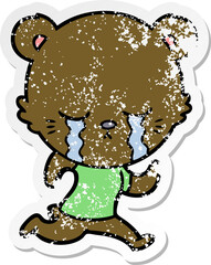 distressed sticker of a crying cartoon bear running