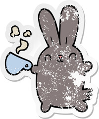 distressed sticker of a cute cartoon rabbit with coffee cup