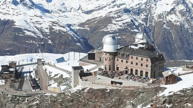 Aerial panorama view of the luxury hotel and the astronomic observatory at the Gornergrat, in the background of the Matterhorn or Cervino mount, Zermatt, Valais, Switzerland, Europe