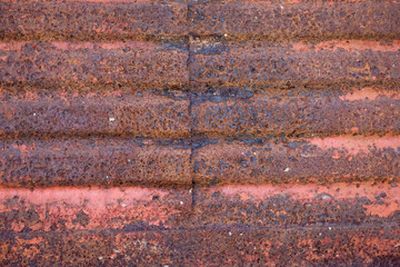 Rusted and corrugated matal surface.