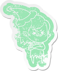 annoyed cartoon distressed sticker of a vampire girl wearing santa hat