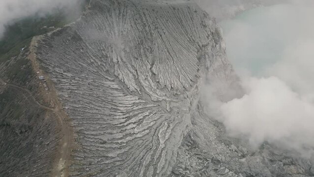 Stunning aerial view of Ijen Volcano with turquoise acid lake. East Java, Indonesia.