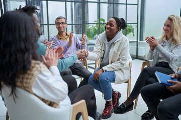 A group of different people are talking about something.