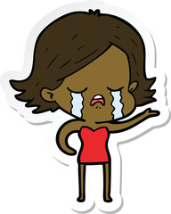 sticker of a cartoon girl crying