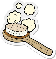 sticker of a cartoon old brush