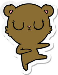 sticker of a peaceful cartoon bear cub