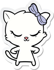 sticker of a cute cartoon cat with bow