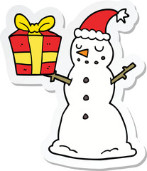 sticker of a cartoon snowman with present