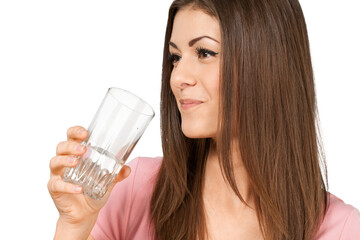 Friendly Young Woman Holding Glass of Water - Isolated