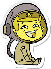 sticker of a cartoon laughing astronaut