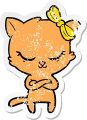 distressed sticker of a cute cartoon cat with bow