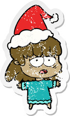 distressed sticker cartoon of a tired woman wearing santa hat