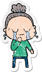 distressed sticker of a cartoon old woman crying