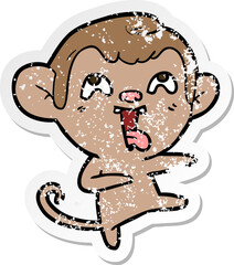 distressed sticker of a crazy cartoon monkey