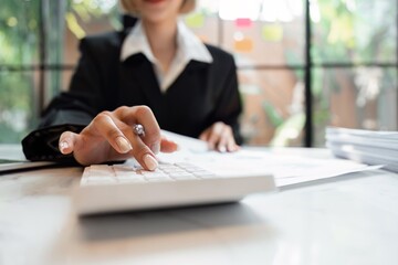 Accountant woman working on laptop and do document, tax, exchange, accounting and Financial advisor concept