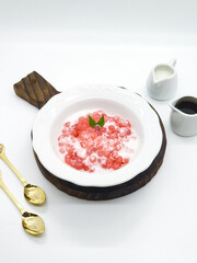 Bubur Sagu Mutiara, Indonesian Dessert Porridge. Made from pearl sago (sagu mutiara), sugar, pandan leaves, and coconut milk. Space for text