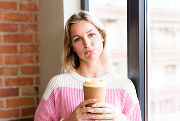 pretty young woman with a hot coffee drink. house interior design