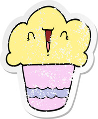 distressed sticker of a cartoon cupcake with face