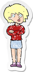 retro distressed sticker of a cartoon woman wit crossed arms