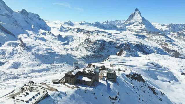 Aerial panorama view of the luxury hotel and the astronomic observatory at the Gornergrat, in the background of the Matterhorn or Cervino mount, Zermatt, Valais, Switzerland, Europe