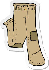 sticker of a cartoon patched old pants
