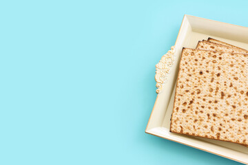 Pesah celebration concept (jewish Passover holiday) over pastel blue background