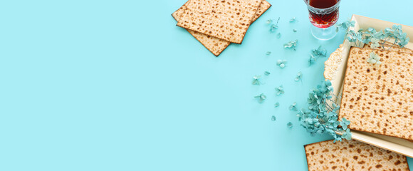Pesah celebration concept (jewish Passover holiday) over pastel blue background