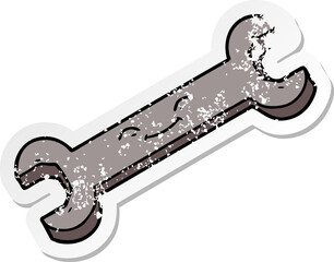 distressed sticker of a cartoon spanner