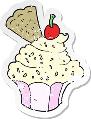 retro distressed sticker of a cartoon cupcake