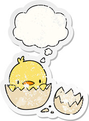 cartoon chick and thought bubble as a distressed worn sticker